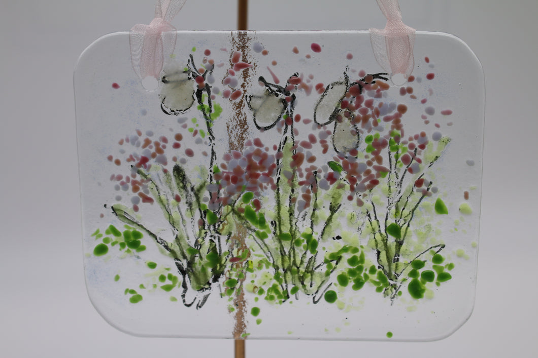 White and Pink Flower in field Suncatcher