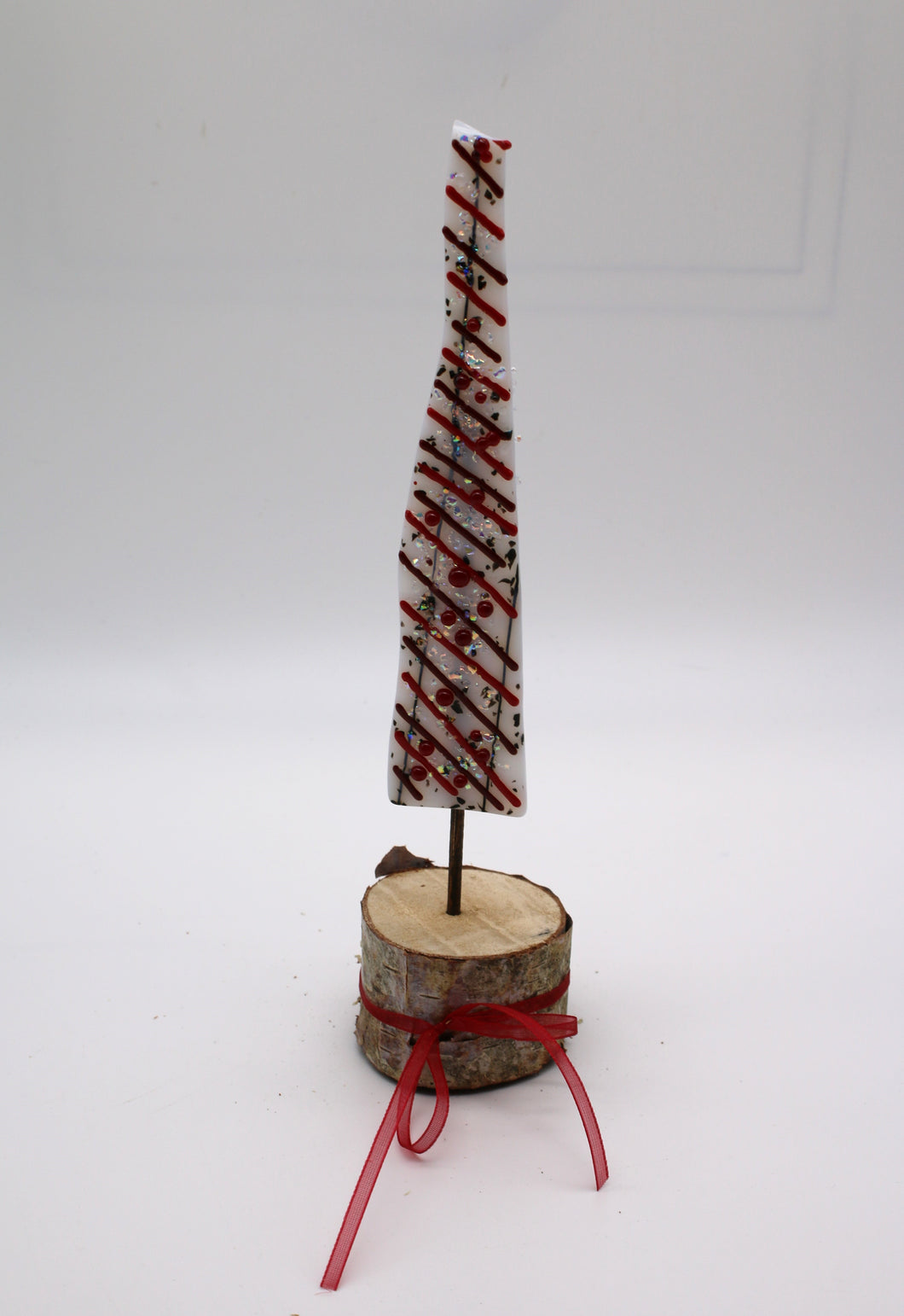 Christmas Tree with Red stringers and berries in birch wood stand