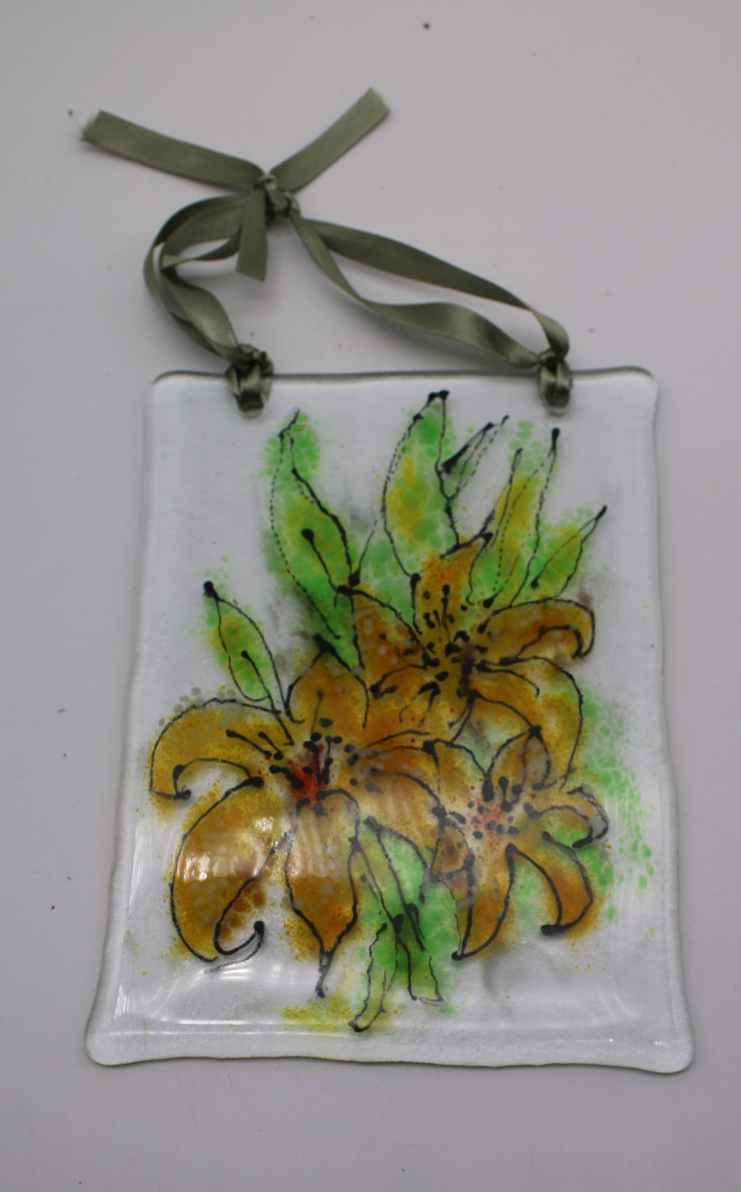 Yellow Lilies Suncatcher hung by green Ribbon