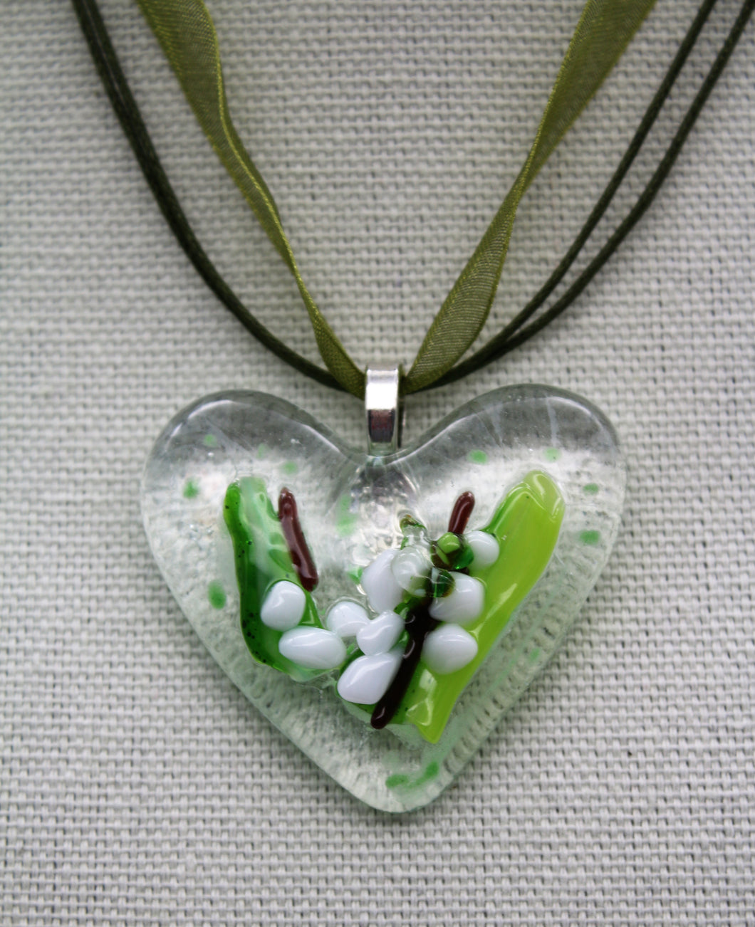 Jewelry - Clear Heart with small pieces of glass depicting a Lilly flowers