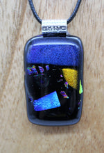 Load image into Gallery viewer, Jewelry - Small Oblong Opaque Black with Varying Color pieces of Dichroic glass embedded in Glass pendant
